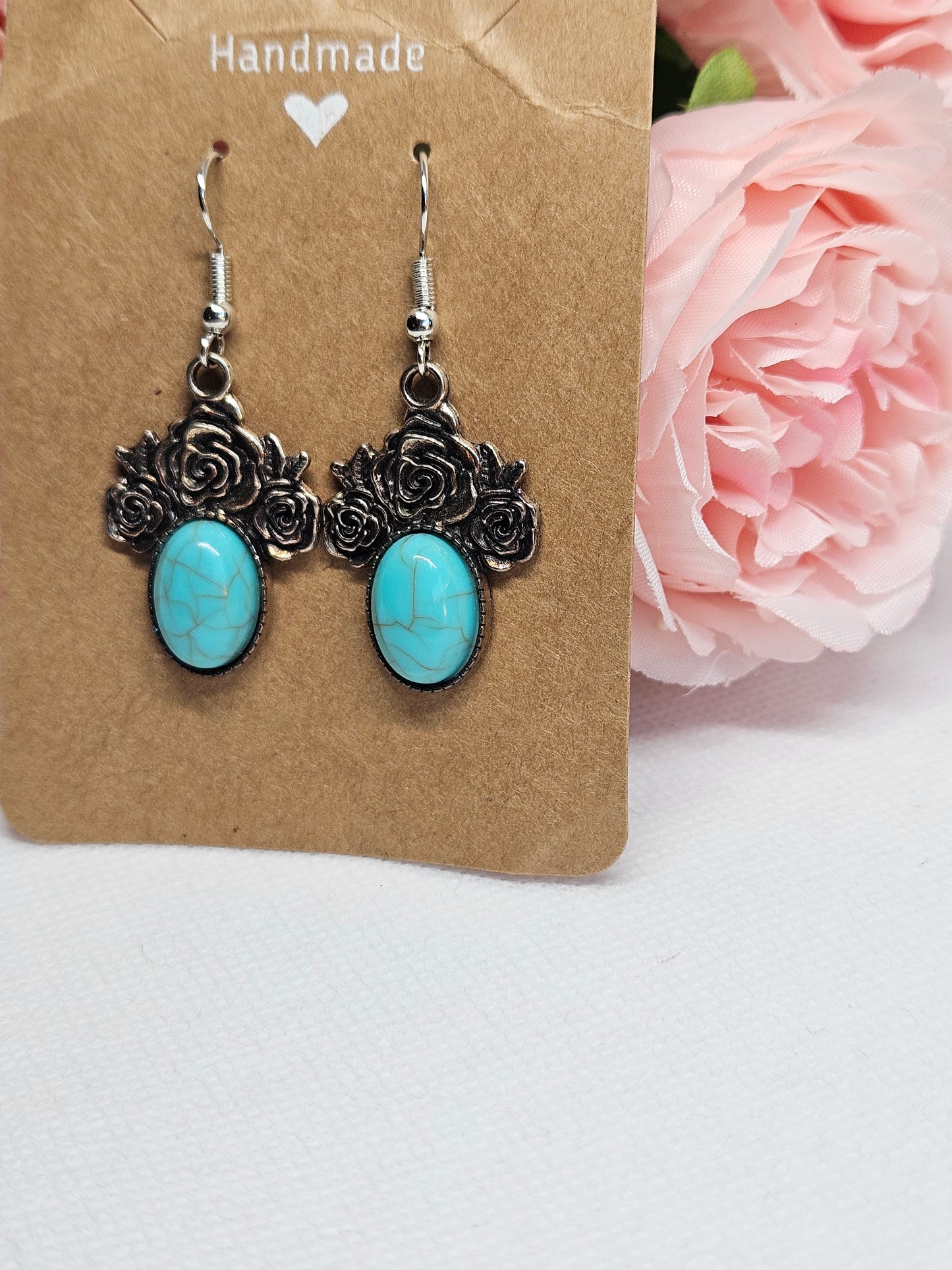 Turquoise Earrings with Rose Design.