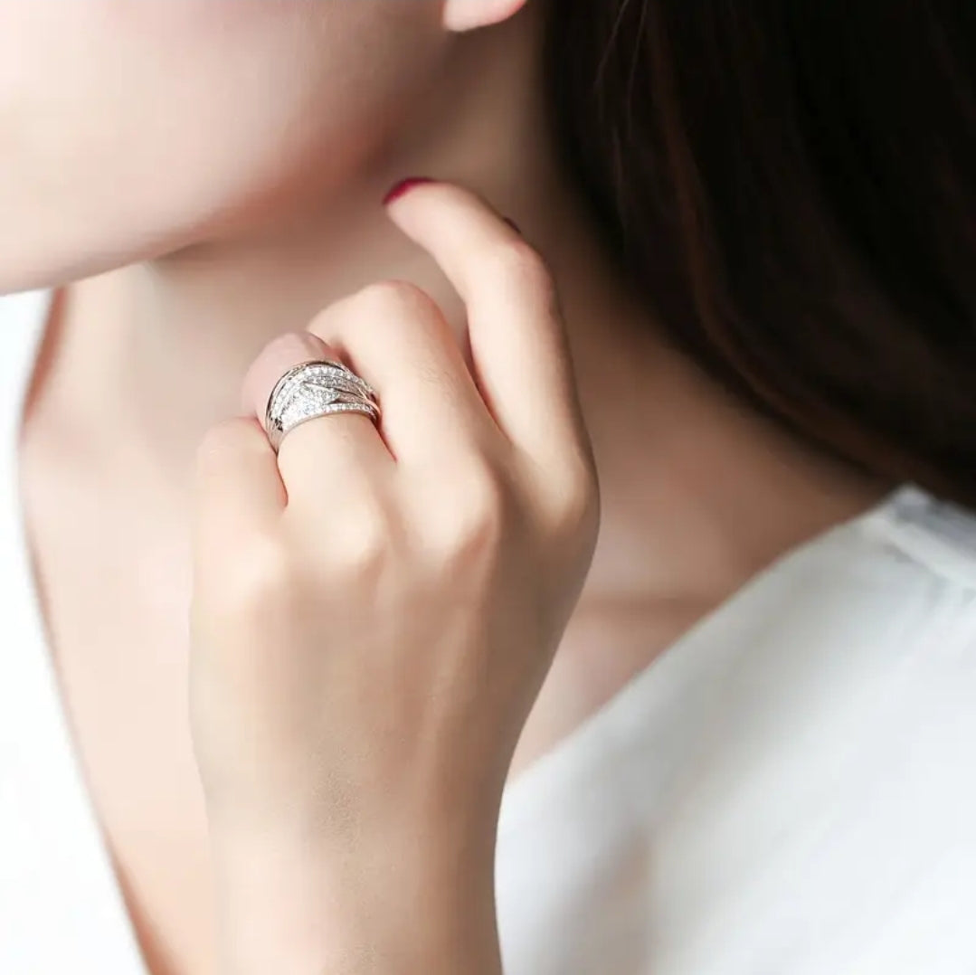 Ring- Elegant Eternity Ring with 18k Gold Interwoven Bands.