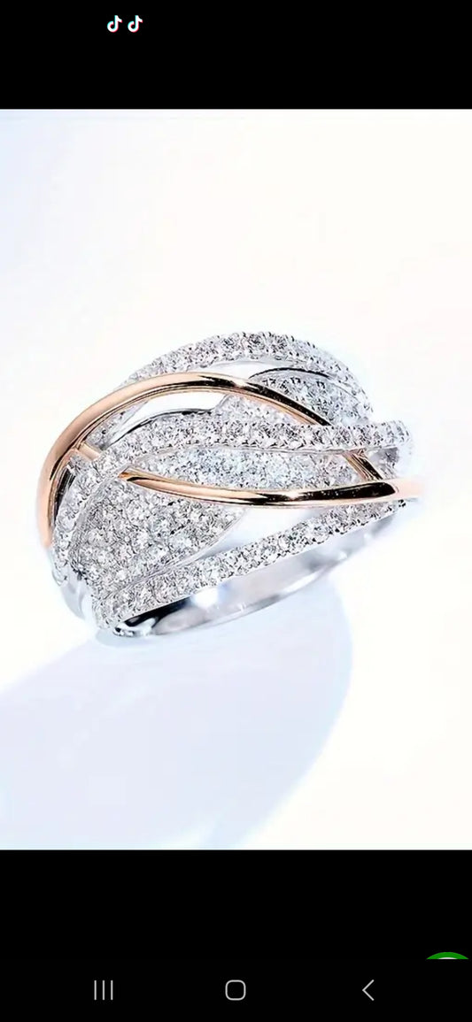 Ring- Elegant Eternity Ring with 18k Gold Interwoven Bands.